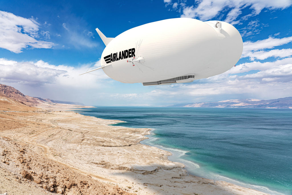 Render of Airlander hybrid vehicle in flight over coast