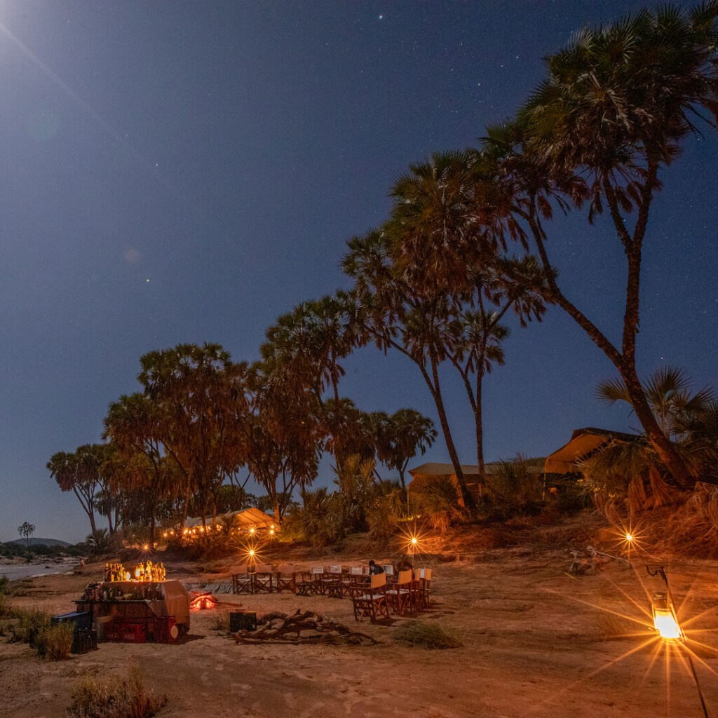 Dining setup in a camp in Kenya at night