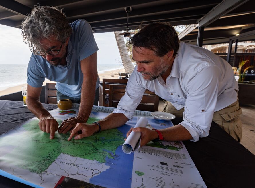 Henry Cookson and guide studying a map