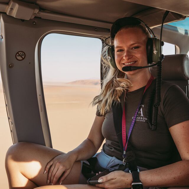 Lara Bates-Prior in a heli