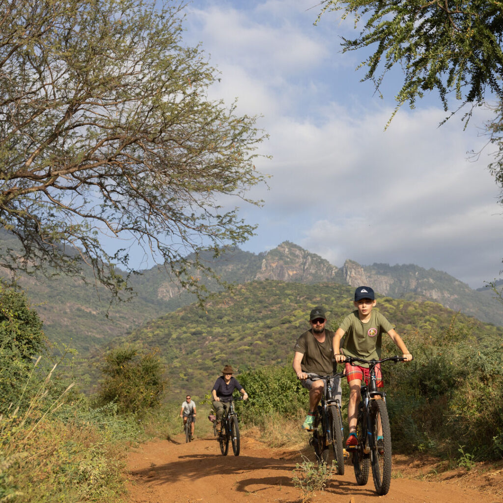 Kids and parents cycling in Kenya