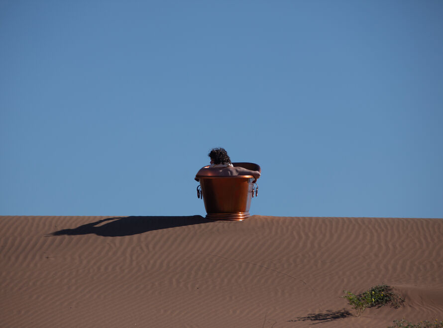 Copper bathtub on a sand dune