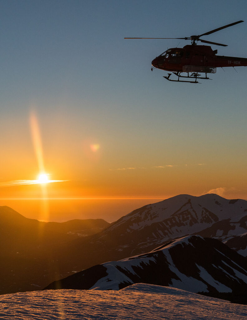 Helicopter with the midnight sun