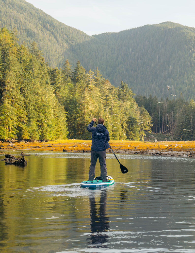 Henry on a paddleboard in the Great Bear Rainforest