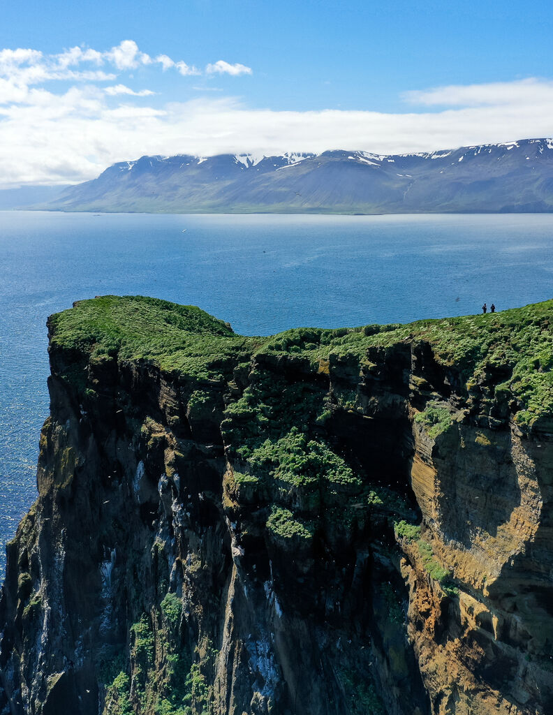 Drone shot of people hiking on an Icelandic island