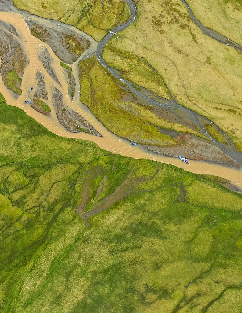 Drone shot of packraft kayaks in Icelandic valley