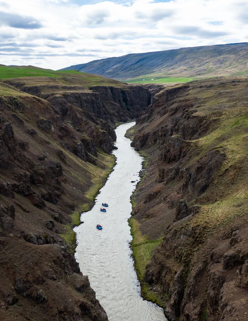 Drone shot of three whitewater rafts