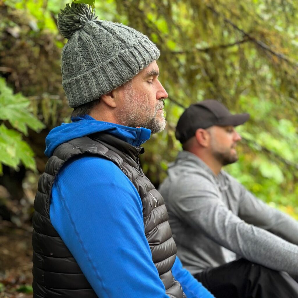 Henry Cookson meditating in a forest