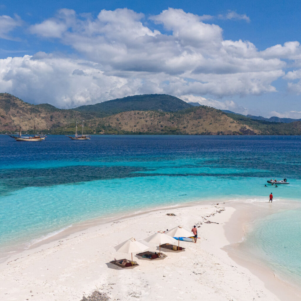 Phinisi yachts with beach setup in Indonesia