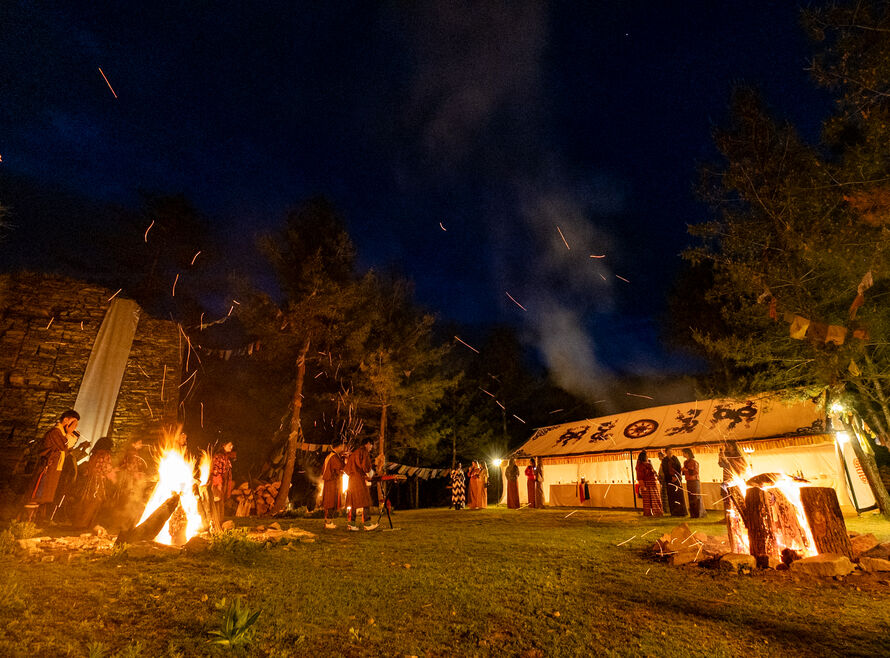 A festival set up in Bhutan, with performers and an audience