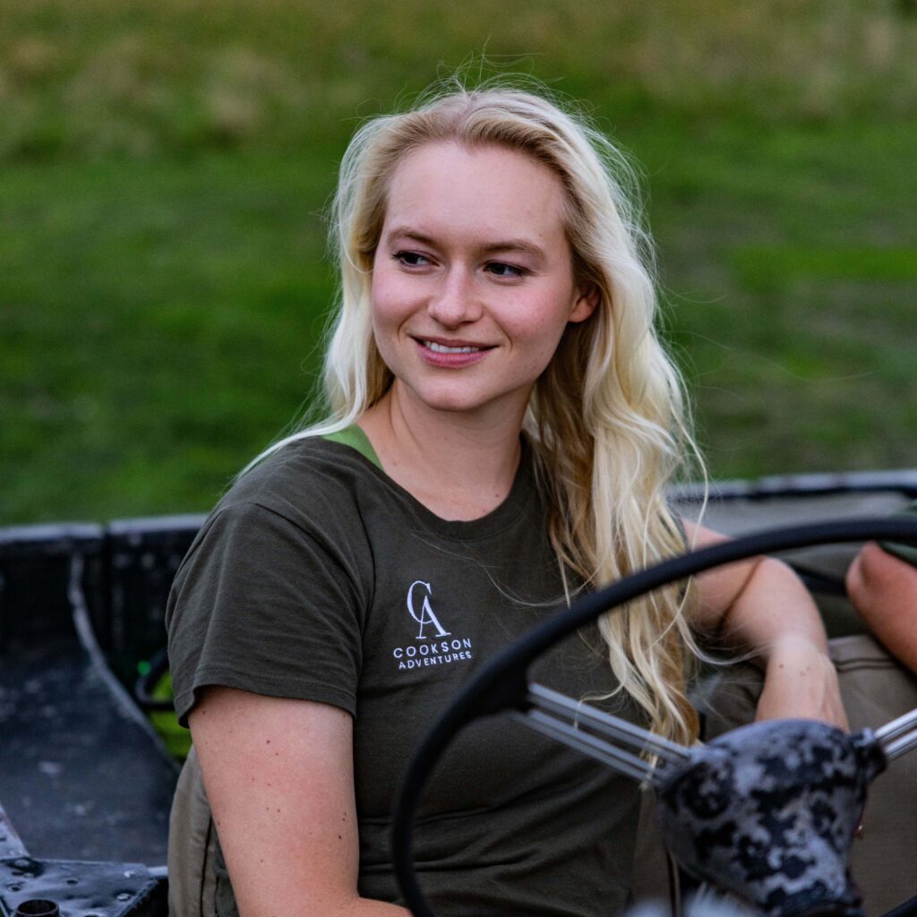 Lara in a safari vehicle